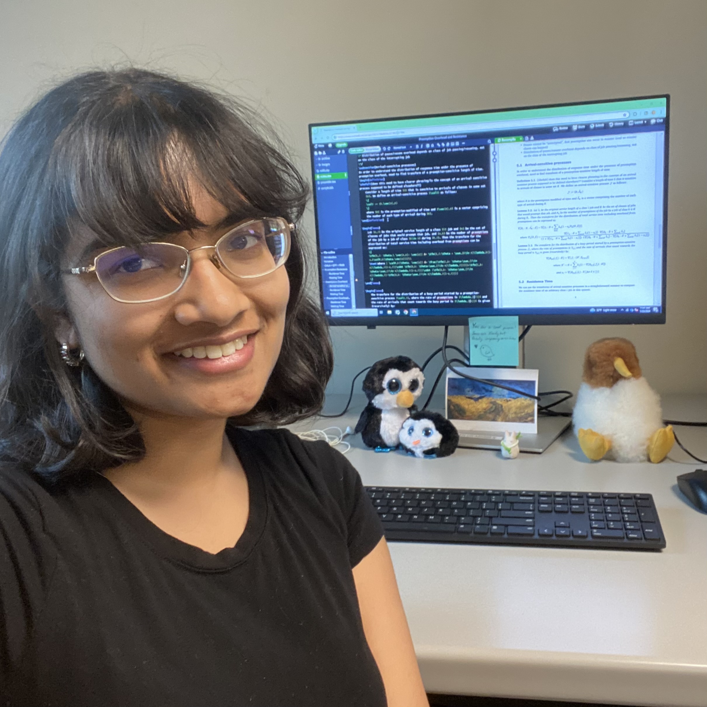 Shefali Profile Picture (she looks cool and smart and has lots of stuffed birds on her desk, along with a computer displaying overleaf and some long formulas)